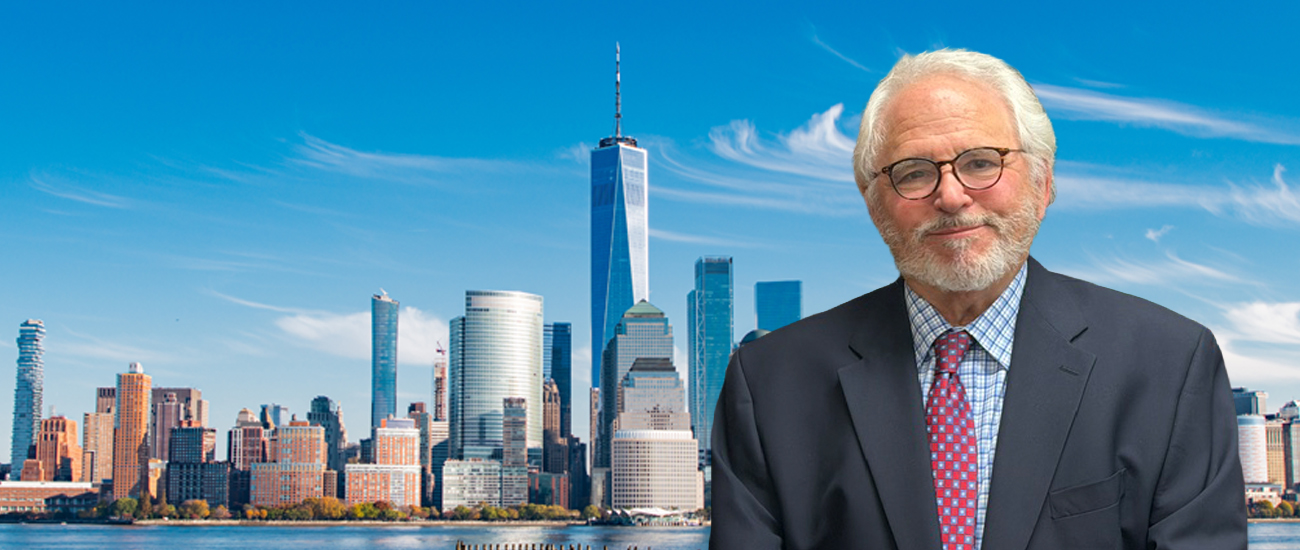 Bill Wolfson in front of the Lower Manhattan skyline and One World Trade Center