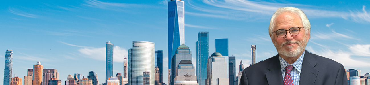 Bill Wolfson in front of the Lower Manhattan skyline and One World Trade Center